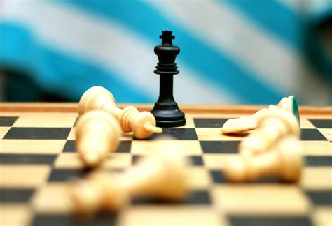Wins at chess .